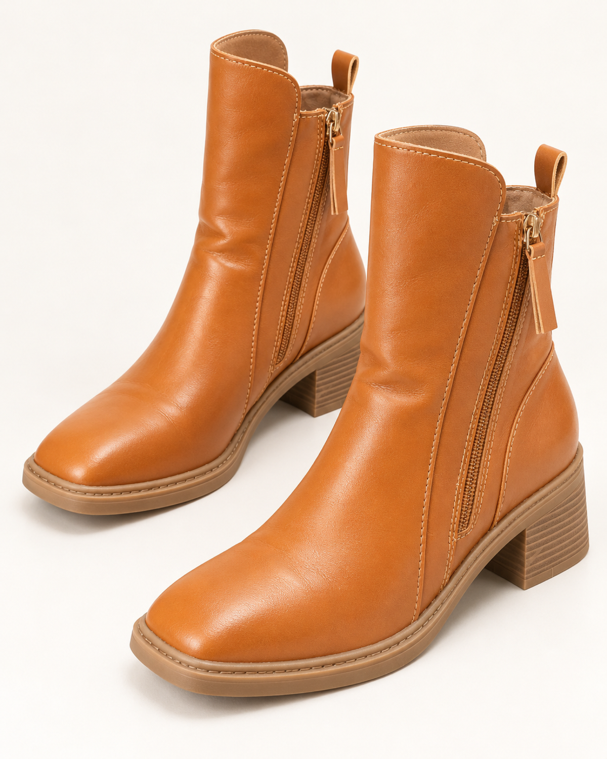 Women's brown chunky block heel ankle boots, front three-quarter studio view