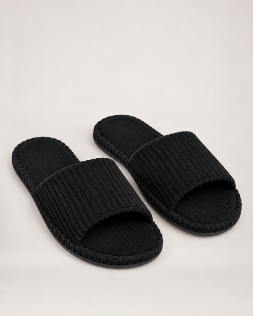 Men's black corduroy open-toe slippers, front three-quarter studio view