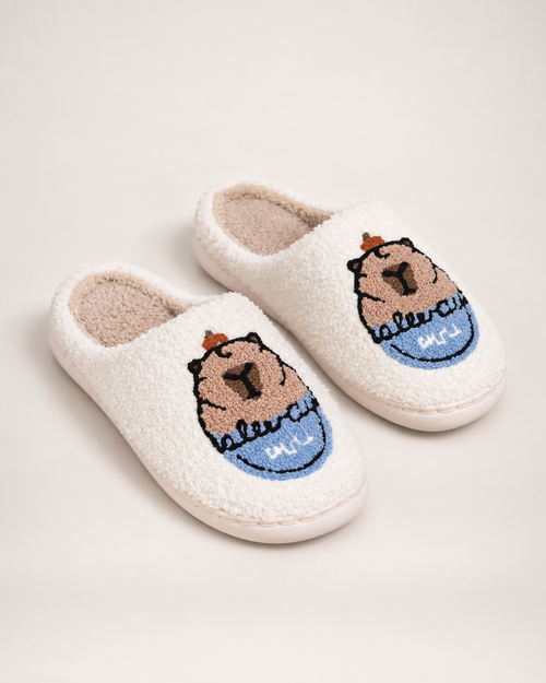 White embroidered capybara slippers shown as a complete matching pair