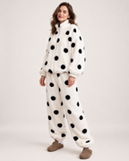 Women's white polka-dot fleece pyjama set, front three-quarter studio view