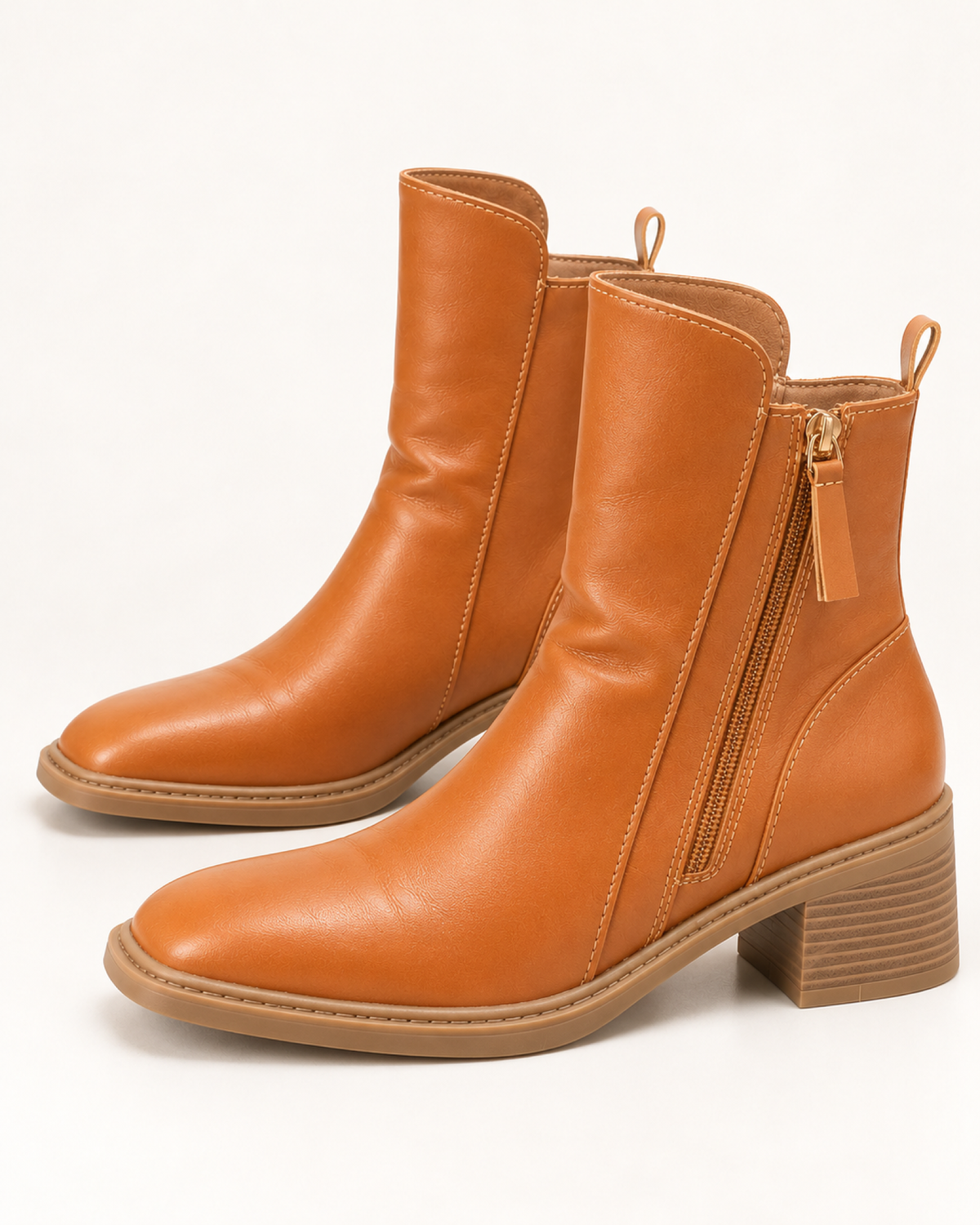 Women's brown chunky block heel ankle boots, side profile studio view