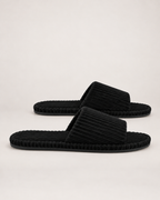 Men's black corduroy open-toe slippers, outer side studio view