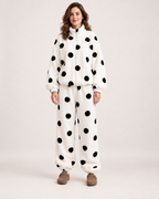 Women's white polka-dot fleece pyjama set, straight front studio view