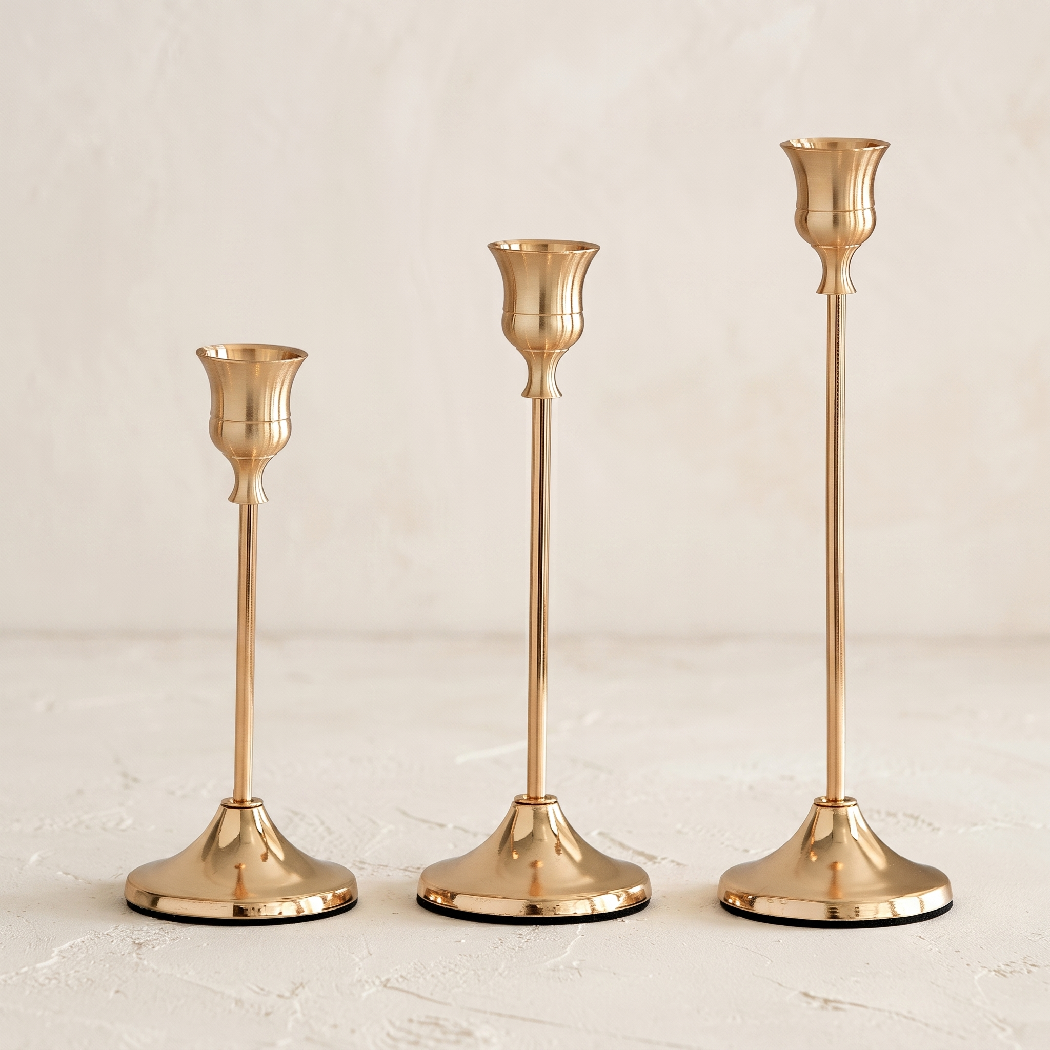 French Gold taper candle holder set showing three graduated heights