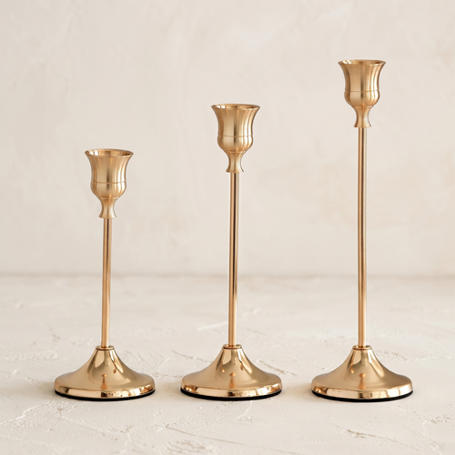 French Gold taper candle holder set showing three graduated heights