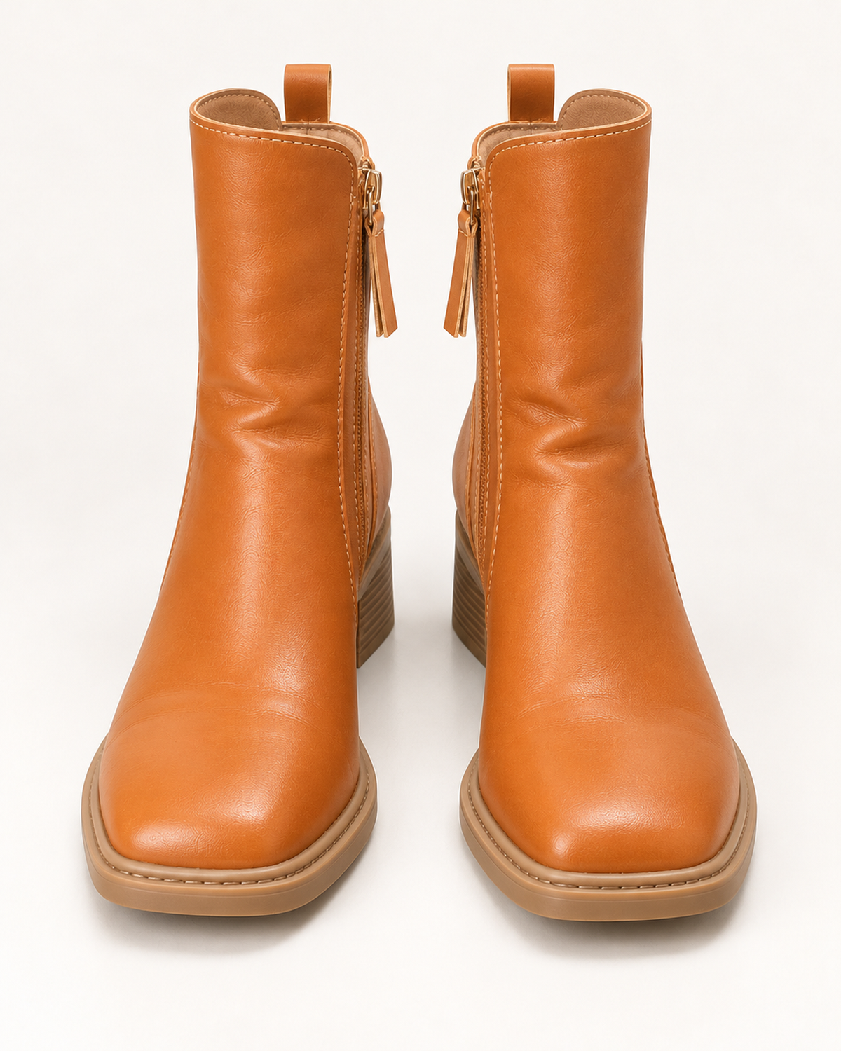 Women's brown chunky block heel ankle boots, front studio view