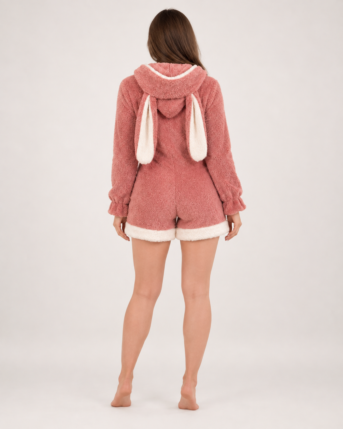 Women's pink short bunny-ear fleece onesie, rear studio view