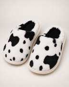 Women's Spotted Cow Slippers in Black, raised front view