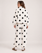 Women's white polka-dot fleece pyjama set, rear studio view