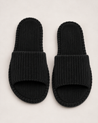 Men's black corduroy open-toe slippers, near-top studio view