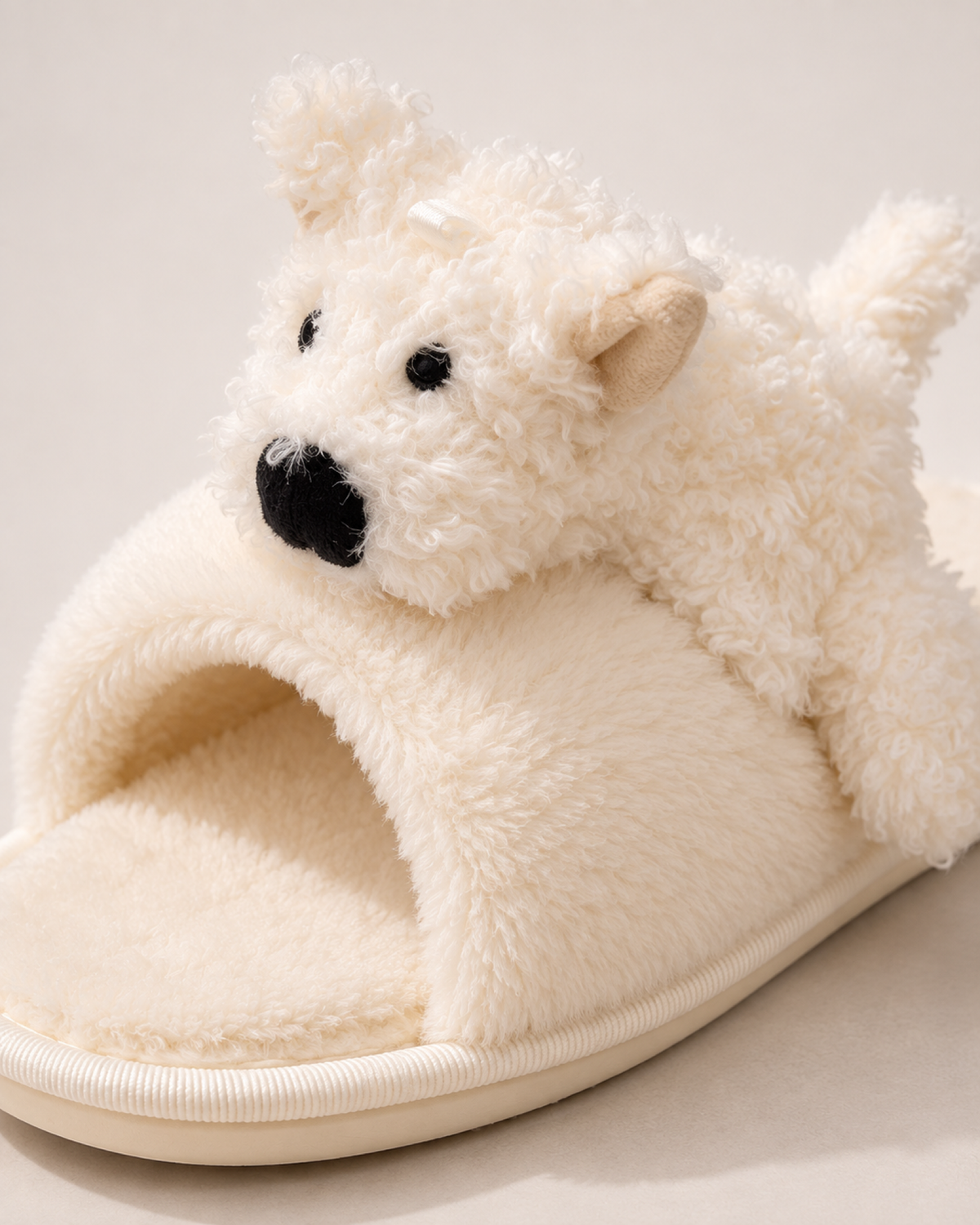 Close view of the puppy detail, crossover strap and plush texture