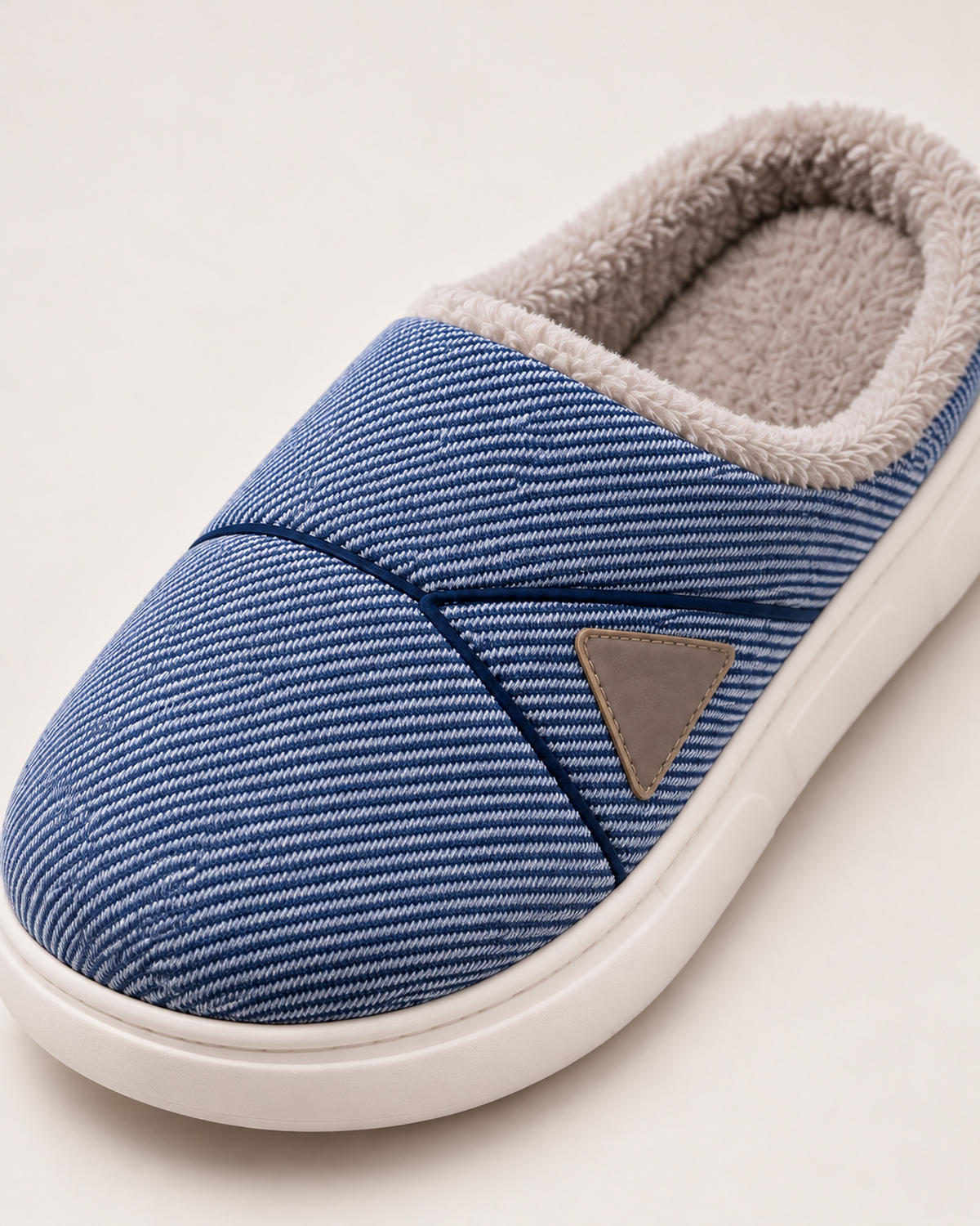 Men's Slippers - Chevron-Panel Plush Style, close detail of striped upper, diagonal chevron seam, triangular badge and plush collar