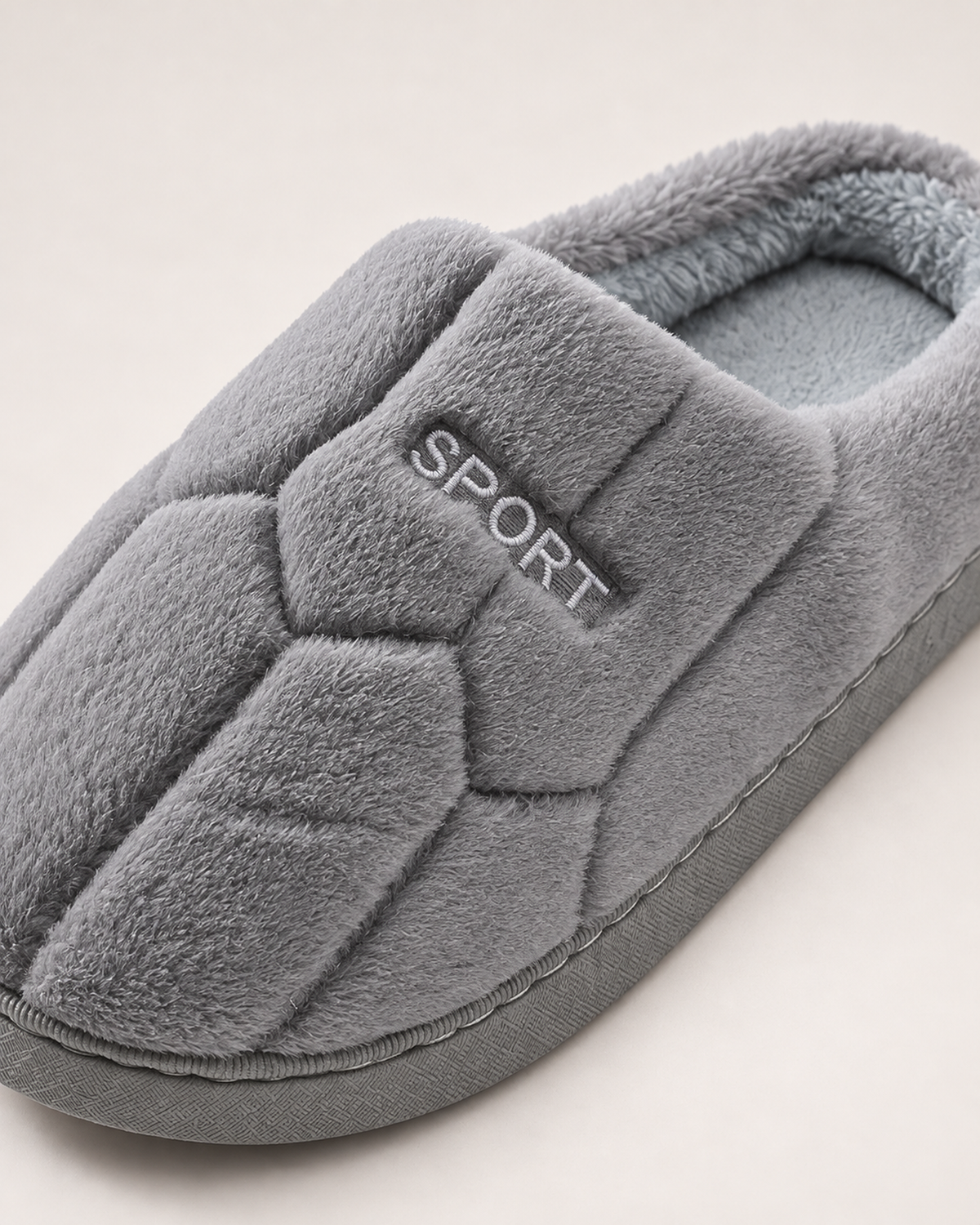 Men's Slippers - Quilted Sport-Patch Style, close detail of quilted upper, small sport patch, plush collar and sole edge