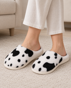 Women's Spotted Cow Slippers in Black, relaxed indoor lifestyle