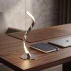Warm chrome spiral lamp on a contemporary home office desk