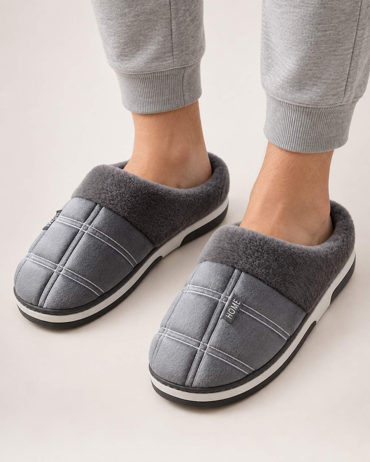 Men's Ribbed Sole Slippers in Grey, worn indoors