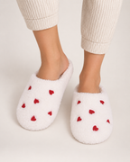 Heart Print Fluffy Slippers in White, worn indoors