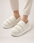 Padded Closed Back Slippers in White, worn indoors