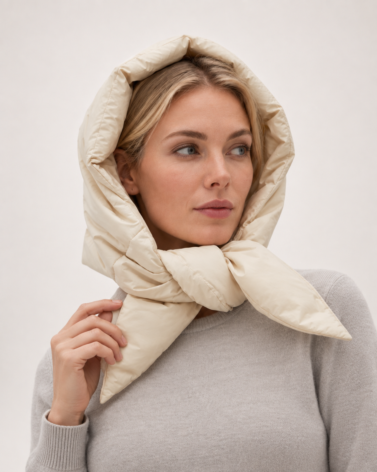 Women's Quilted Puffer Headscarf in Cream, worn interaction view