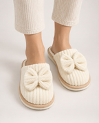 Women's Corduroy Bow Slippers in Beige, worn indoors