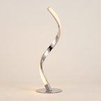 Front view of the warm chrome spiral LED table lamp