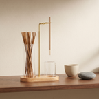 Aurelia Figure-Eight Incense Burner in Natural Glow — Communicate realistic compact scale using familiar objects instead of a dimension graphic.