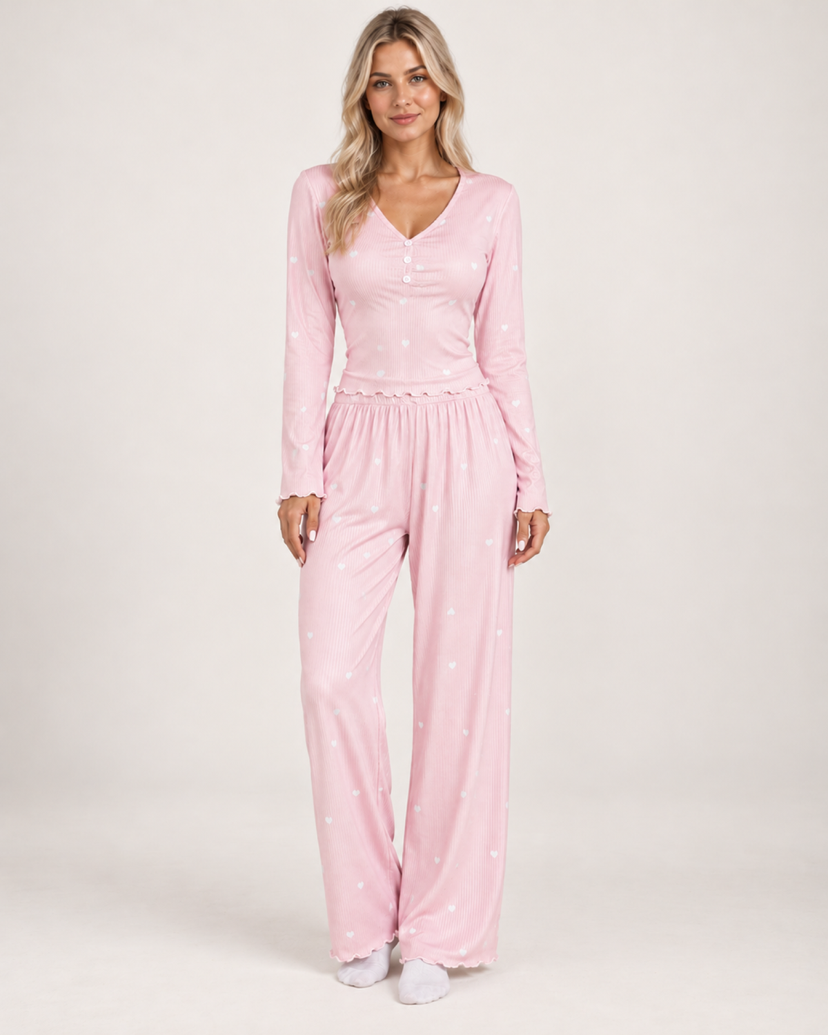 Women's pink and white V-neck button-front pyjama set, front studio view