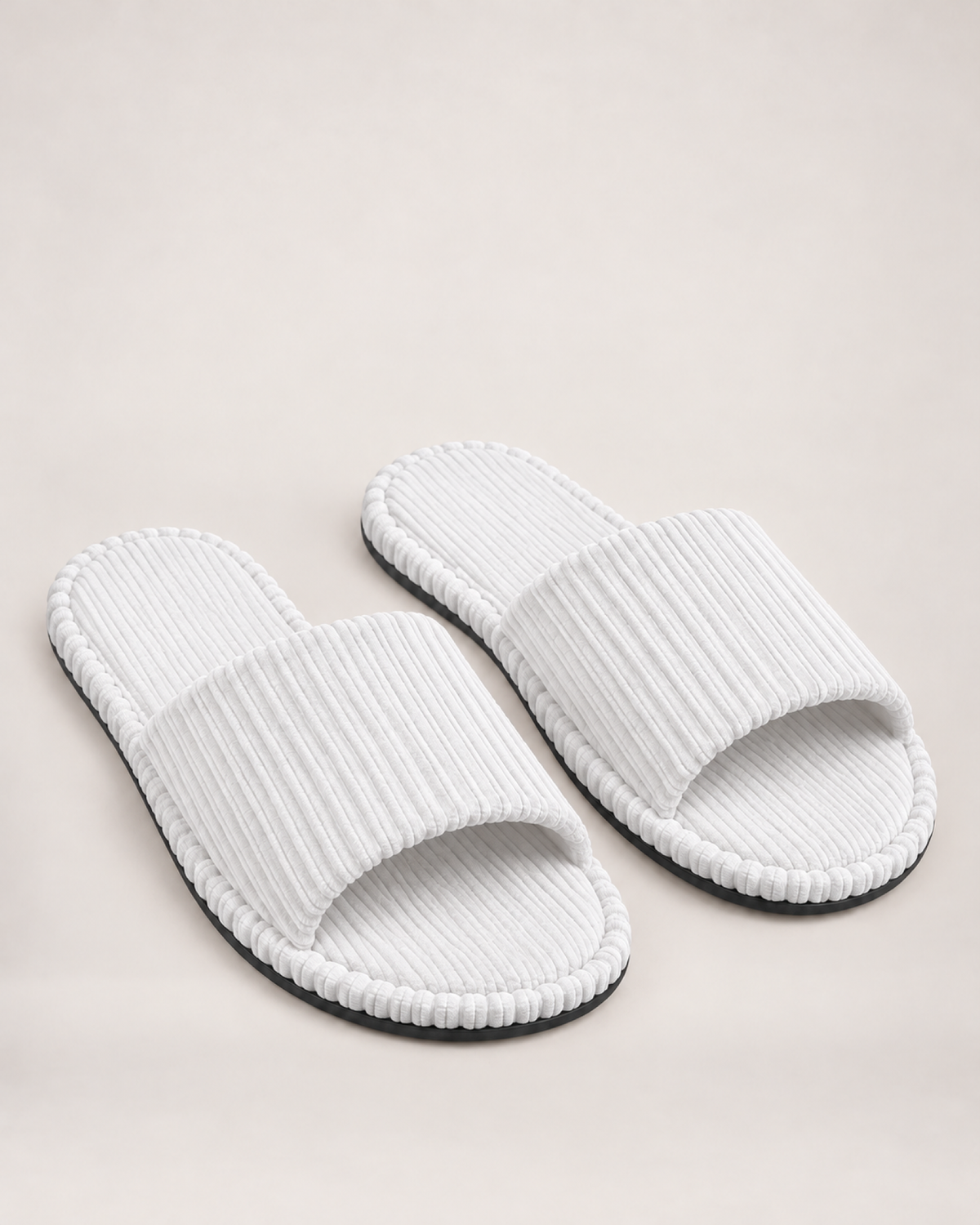 Men's white corduroy open-toe slippers, front three-quarter studio view