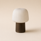 Ribbed ivory table lamp from a right three-quarter angle