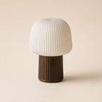 Ribbed ivory table lamp with a dark bronze fluted base