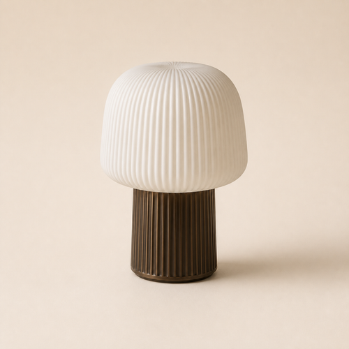Ribbed ivory table lamp with a dark bronze fluted base