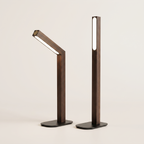 Two complete walnut finish rechargeable table lamps on a neutral background